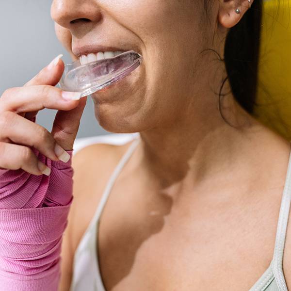 Athlete wearing sports mouth guard Ann Arbor dentists